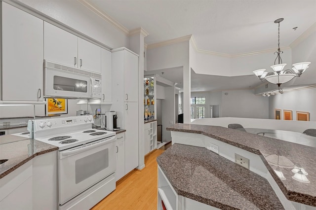 kitchen with hanging light fixtures, white cabinetry, light hardwood / wood-style flooring, and white appliances