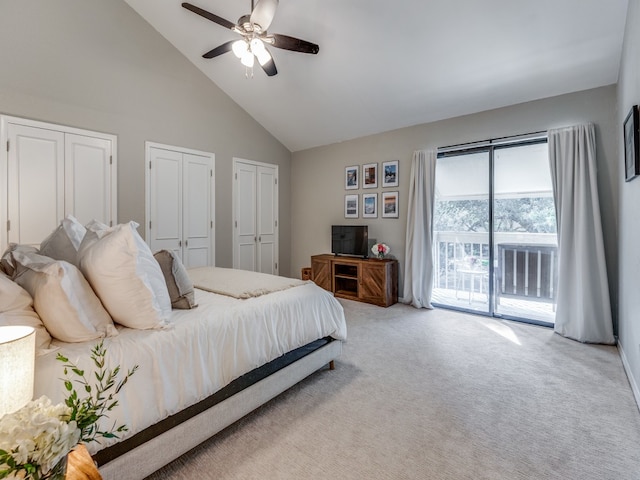 carpeted bedroom with ceiling fan, multiple closets, access to outside, and high vaulted ceiling