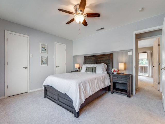 carpeted bedroom featuring ceiling fan