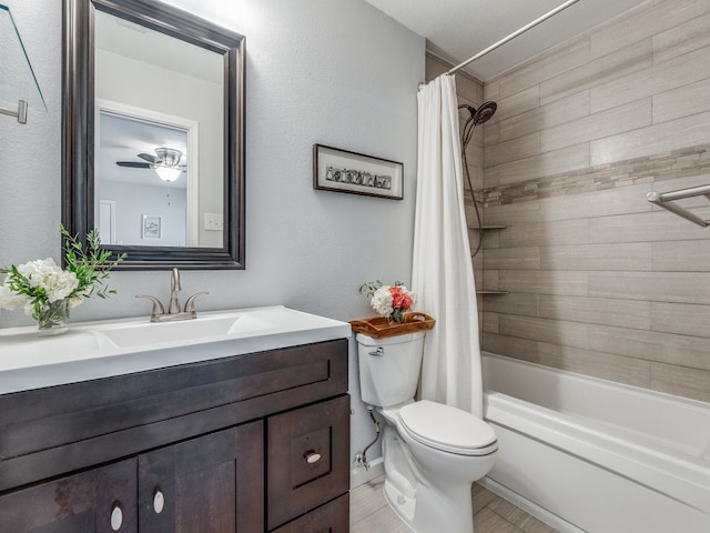 full bathroom featuring vanity, shower / tub combo, toilet, and ceiling fan