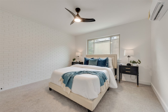 bedroom featuring brick wall, carpet flooring, an AC wall unit, and ceiling fan