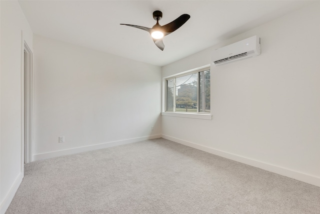 carpeted empty room featuring a wall mounted air conditioner and ceiling fan