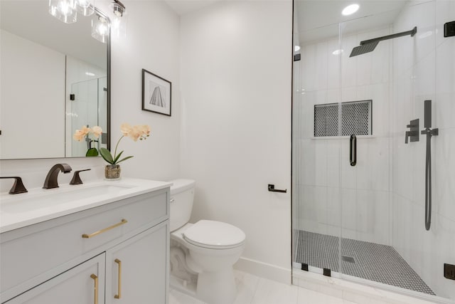 bathroom featuring tile patterned flooring, vanity, a shower with door, and toilet