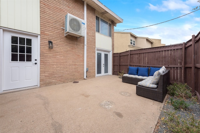 view of patio / terrace featuring french doors and ac unit