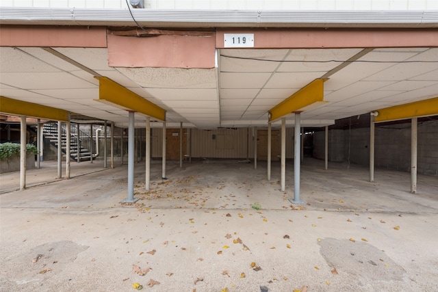 basement with a paneled ceiling