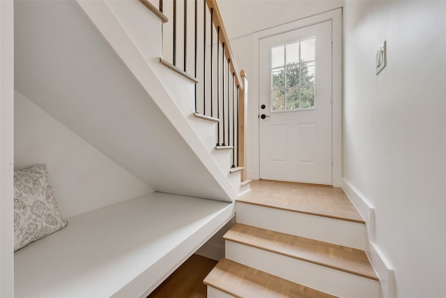 staircase featuring hardwood / wood-style flooring