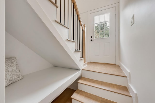 4039 Cole Ave Unit 119, Dallas, TX 75204 - stairway featuring wood finished floors