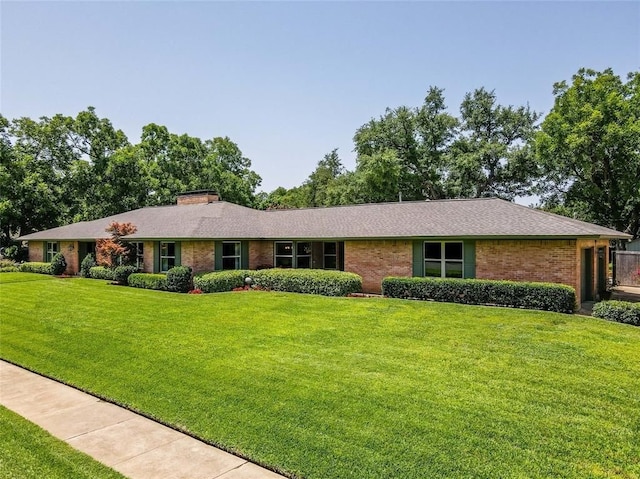 ranch-style house with a front yard