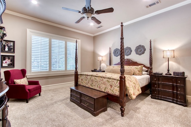 carpeted bedroom featuring ceiling fan and crown molding