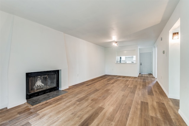 unfurnished living room with light wood-type flooring