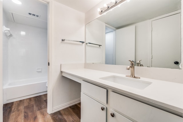 full bathroom featuring vanity, bathtub / shower combination, toilet, and wood-type flooring