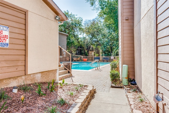 view of swimming pool with a patio