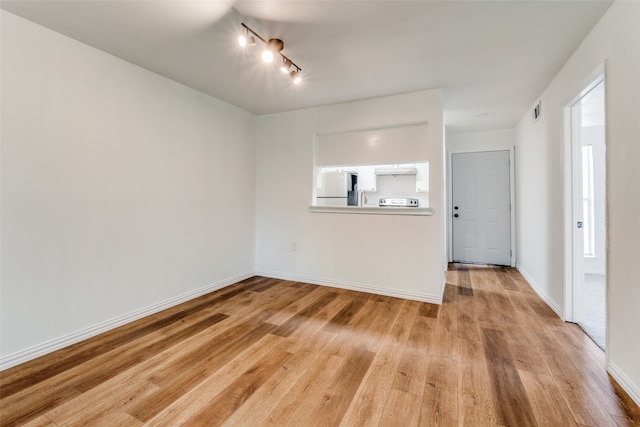 unfurnished room featuring light hardwood / wood-style floors