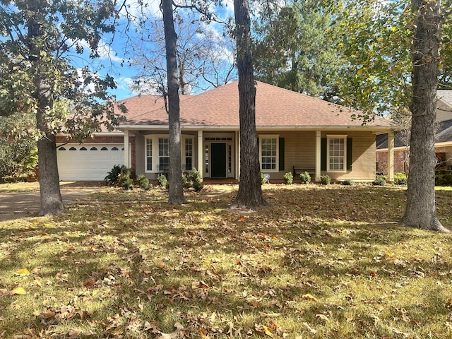 ranch-style house with a garage and a front lawn