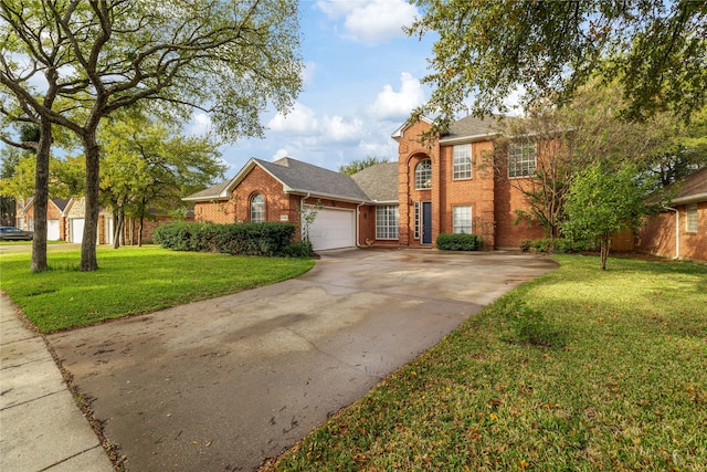 view of front of home with a front lawn and a garage