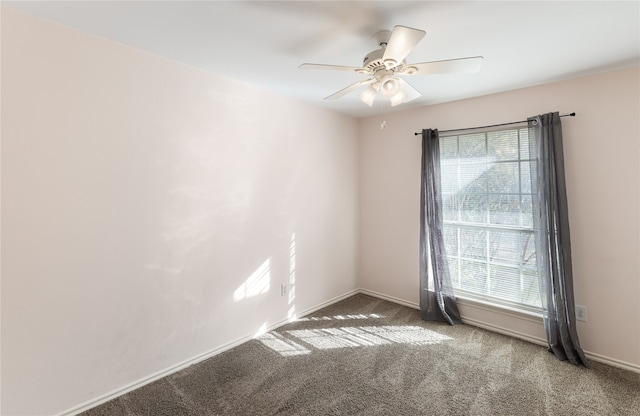 spare room with carpet floors and ceiling fan