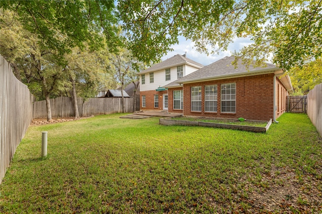 back of property featuring a lawn