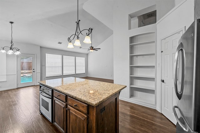 kitchen featuring a kitchen island, dark hardwood / wood-style floors, ceiling fan with notable chandelier, built in shelves, and stainless steel appliances