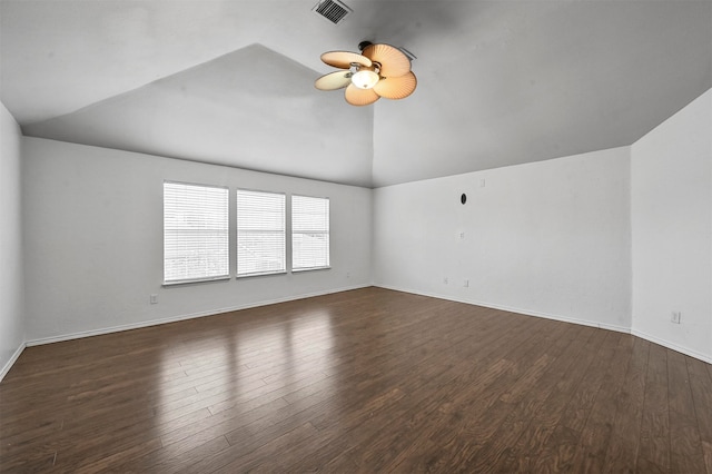 unfurnished room with dark wood-type flooring, vaulted ceiling, and ceiling fan