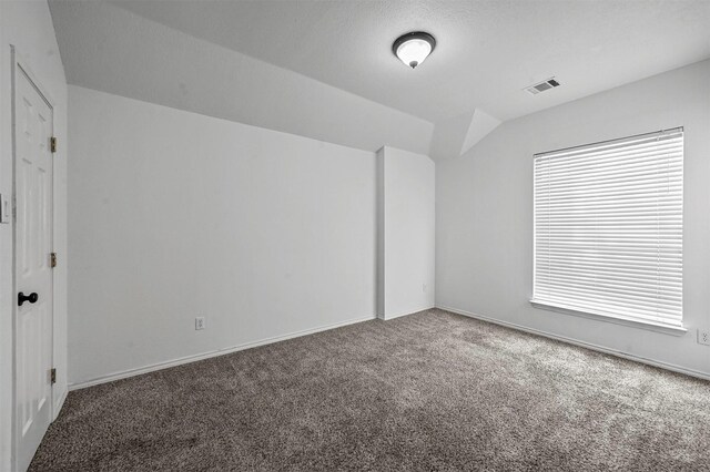2221 Pittner Ln, Plano, TX 75025 - unfurnished bedroom with carpet flooring, lofted ceiling, baseboards, and multiple windows