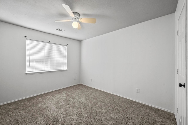 2221 Pittner Ln, Plano, TX 75025 - empty room with ceiling fan, carpet floors, a textured ceiling, and baseboards