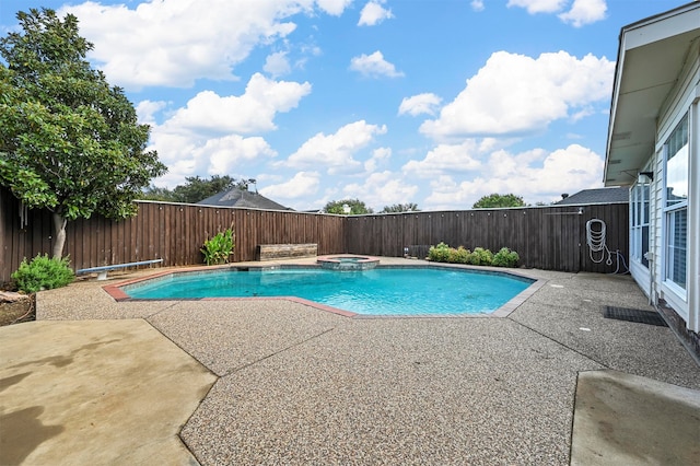 view of swimming pool with an in ground hot tub and a patio