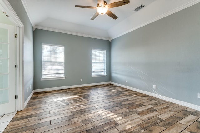 spare room with hardwood / wood-style flooring, ceiling fan, ornamental molding, and lofted ceiling