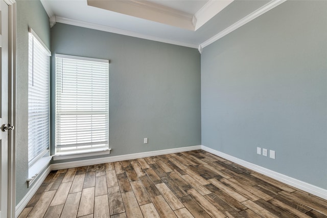 unfurnished room featuring hardwood / wood-style flooring and crown molding