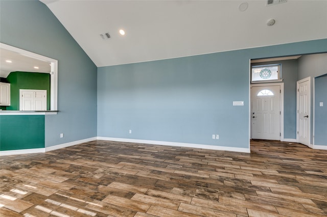 unfurnished living room with high vaulted ceiling and hardwood / wood-style flooring