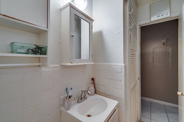 bathroom featuring tile patterned flooring and vanity