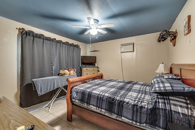 bedroom with light tile patterned flooring, ceiling fan, and a wall mounted AC