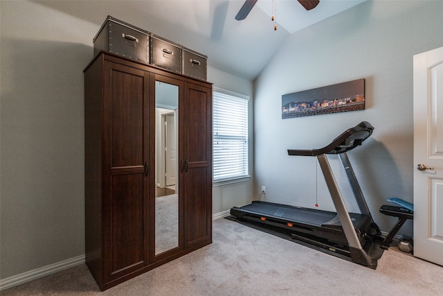 workout area with lofted ceiling, light colored carpet, and ceiling fan