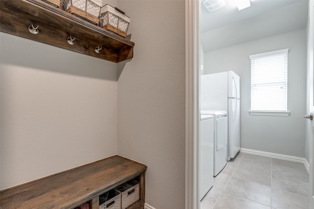 clothes washing area featuring separate washer and dryer