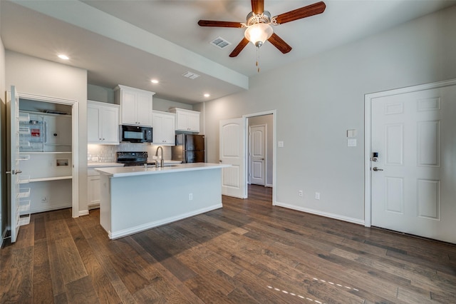 kitchen featuring black appliances, decorative backsplash, sink, white cabinetry, and a kitchen island with sink