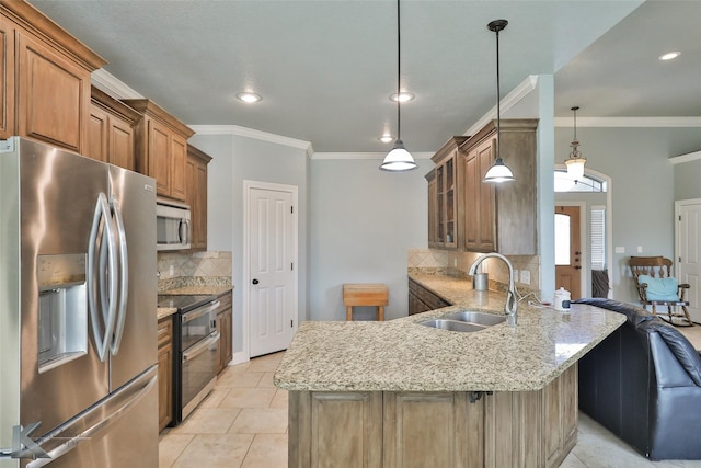 kitchen featuring light tile patterned flooring, appliances with stainless steel finishes, sink, hanging light fixtures, and kitchen peninsula