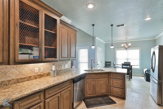 kitchen featuring an inviting chandelier, sink, ornamental molding, and stainless steel appliances