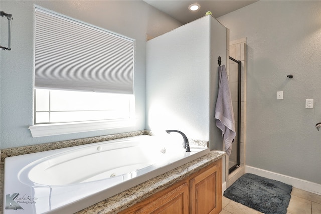 bathroom featuring plus walk in shower and tile patterned flooring