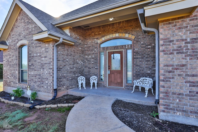 property entrance with covered porch