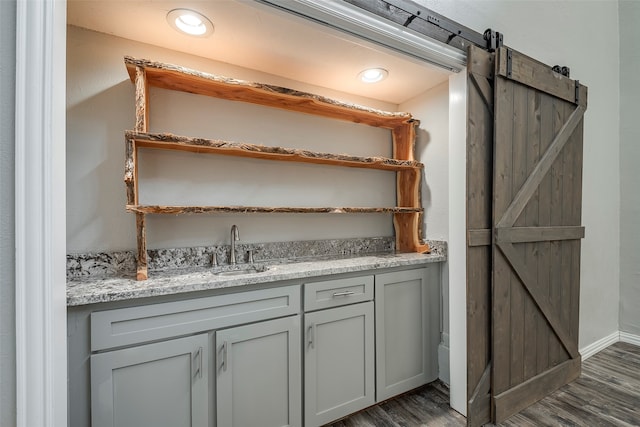 bathroom with vanity and wood-type flooring