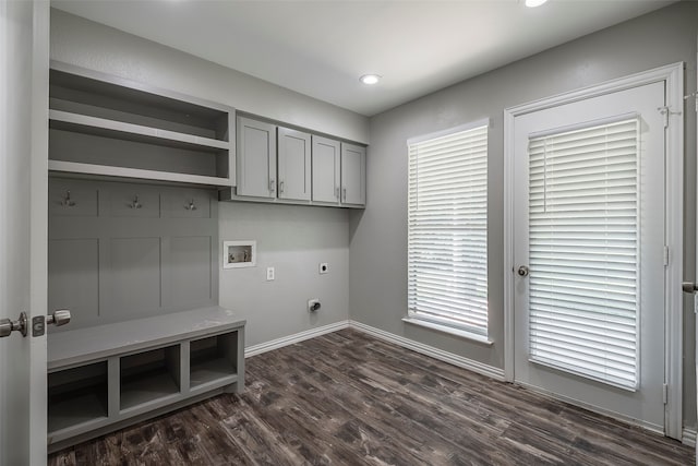 washroom with hookup for a washing machine, electric dryer hookup, cabinets, and dark hardwood / wood-style floors