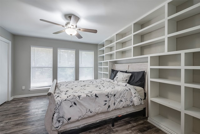 bedroom with dark wood-type flooring and ceiling fan