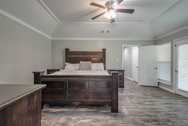 bedroom featuring dark wood-type flooring, ceiling fan, crown molding, and vaulted ceiling