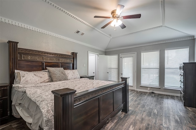 bedroom featuring dark wood-type flooring, ceiling fan, crown molding, and vaulted ceiling