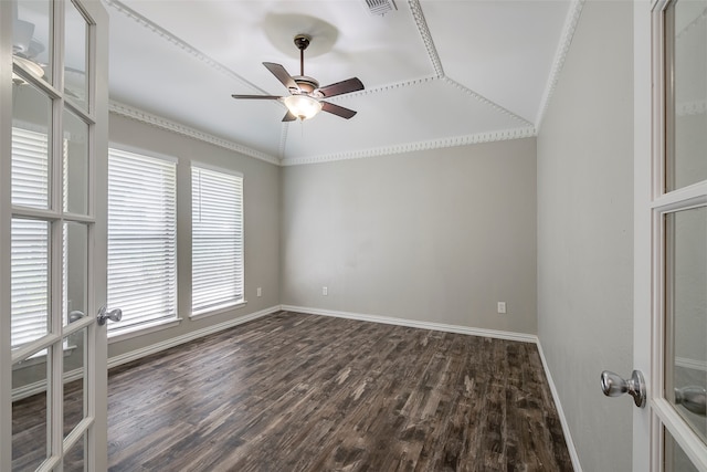 empty room with crown molding, dark hardwood / wood-style flooring, and plenty of natural light