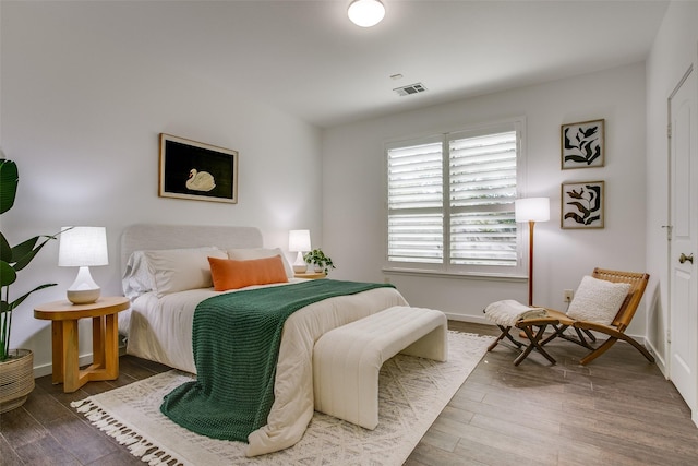 bedroom with wood-type flooring