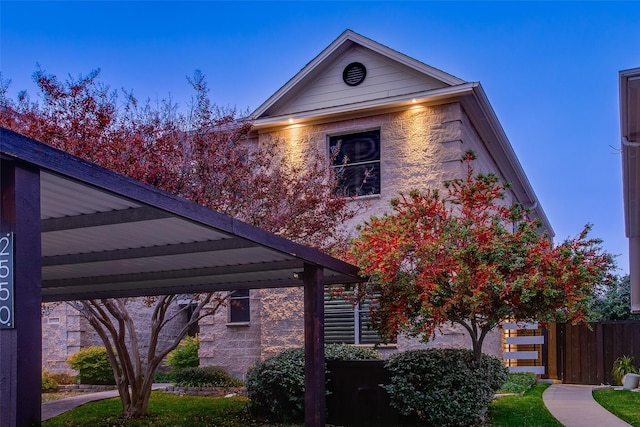 view of home's exterior with a carport