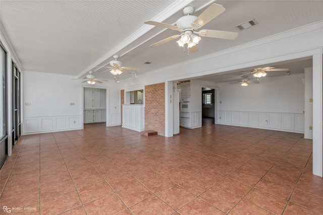 unfurnished room with crown molding and light tile patterned floors