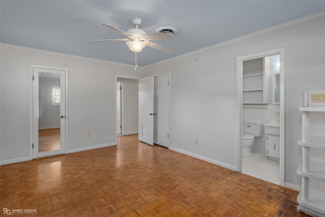 unfurnished bedroom featuring ornamental molding, parquet floors, ensuite bathroom, and ceiling fan