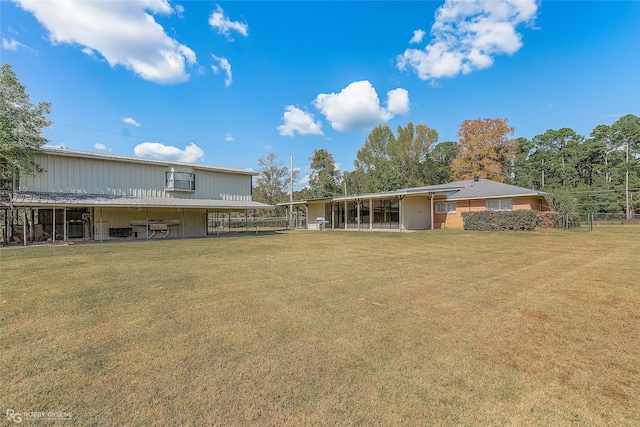 back of house with a lawn