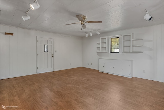 unfurnished living room with rail lighting, light hardwood / wood-style floors, and ceiling fan